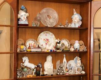 An antique 19th century display cabinet filled with crystal and porcelain treasures including Lladros's, Lalique, Baccarat, and more!