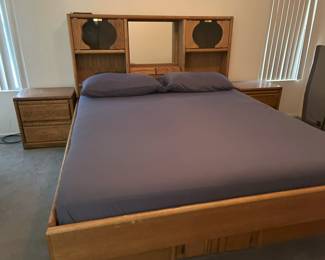 California King platform bedframe with nightstands and drawers on each side and at foot of bedframe