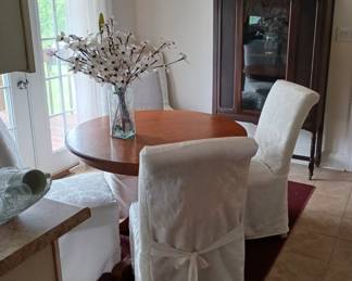 Antique round oak table and china cabinet