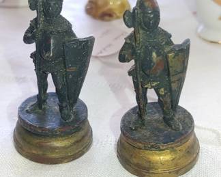 Two very old cast iron small toy soldiers