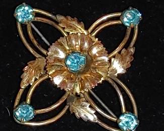Gorgeous vintage 12 carat gold filled brooch beautiful blue rhinestones. I spent about 30 minutes cleaning this pen and it could probably use another half hour! Are you sterling silver wipes. And for someone who's got the time to clean it it can be virtually flawless.