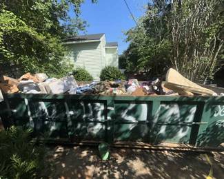 The dumpster is gone! We will be able to put a large tent in the driveway for overflow!