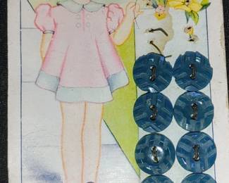 Lots of 1930s buttons on cards with graphics