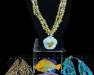 Lemon quartz gemstone necklace and other gemstones and colorful trinkets