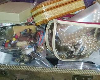 Suitcases full of jewelry to sort through