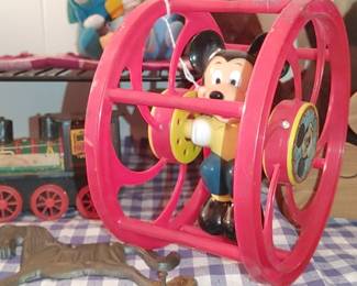 Mickey Mouse rolling toy and other vintage toys