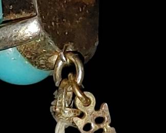 Signed trafari and even has the dangling crownfari symbol