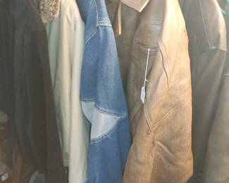 Leather coats at the top of the stairs in closet