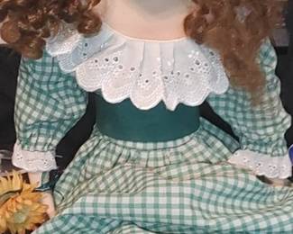 Large Gorgeous bisque porcelain doll -cloth body-jointed head
Red hair - made in the sitting position her legs to dangle