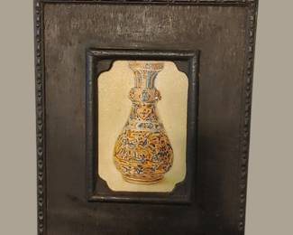 Carved black inset frame with Oriental vase
