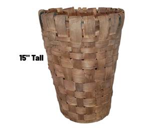 Mid-century modern woven palm leaf basket with metal feet