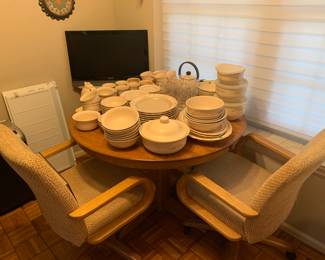 Wood round table and four roller chairs