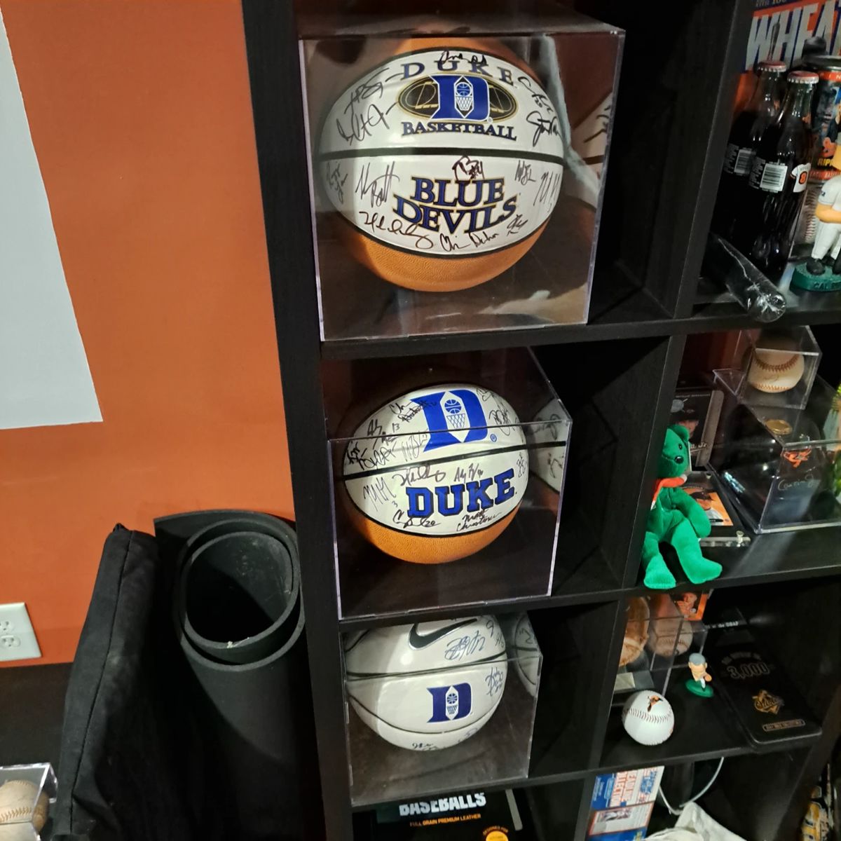 3 championship basketballs signed by entire team.
