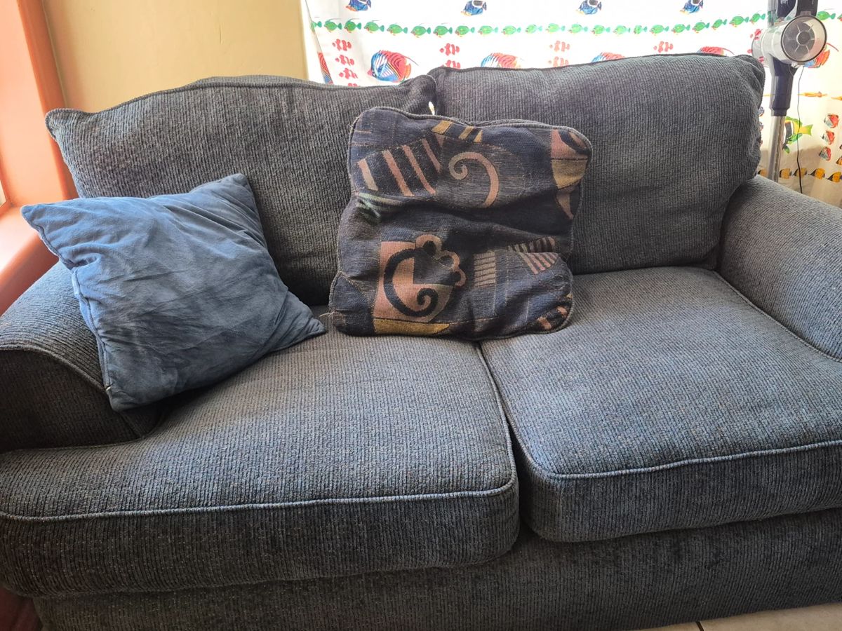 The loveseat that goes with the blue couch.