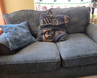 The loveseat that goes with the blue couch.