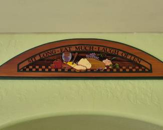 A cozy wall plaque that had been over my kitchen doorway.