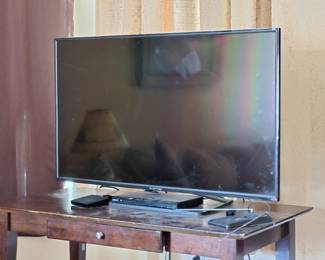 27 inch TV. It has served me well, but I'm not moving into a house for awhile. Alas. the table beneath it is for sale also.