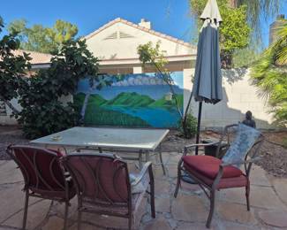 Glass rectangular table - with 4 (one is not in the photo) wrought iron chairs and comfy cushions $150