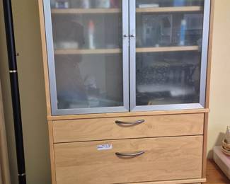 This cabinet goes with the rest of the Ikea (already assembled) furniture - 3 bookshelves and a wrap-around desk. You can buy the whole shebang or each piece separately.