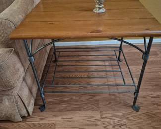 1 of 3 tables - 2 end tables, one coffee table. Wrought iron on the bottom; wood on the top. Sturdy. Sold as a set for $50