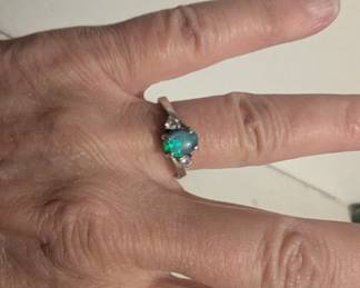 Fire opal in silver with tiny diamonds. Too emotional for me to keep. $85