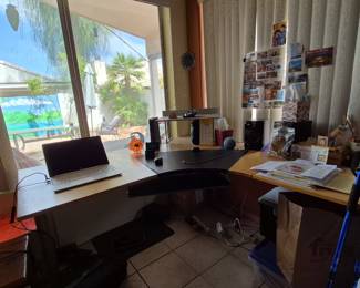 Wrap around Ikea desk - sturdy - blonde wood - goes with the cabinet and bookshelves - but you can buy it separately.
