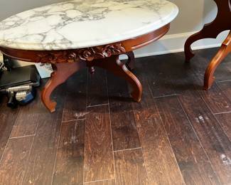 #13 oval marble top coffee table with rose front 35x22x17 $125.00
