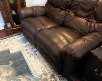Comfy Brown Leather Recliner Couch $700. Matching Loveseat $500
