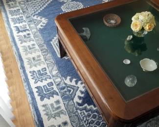 Elegant blue and white area rug; Disney Mickey Mouse glass shadowbox coffee table