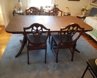 Dining table seats 6; shown with custom table pads. Table top is pristine