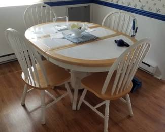 Dining set seats 4; table shown with leaf in place - can be round