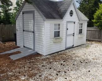 Adorable storage shed is approximately 13 ft. wide x 8 ft. deep