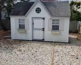 Adorable storage shed is approximately 13 ft. wide x 8 ft. deep