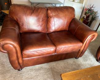 Leather Love Seat 64"L x 35"T x 37"D $255.00