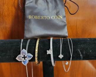 18k Roberto Coin yellow gold bangle and white gold bangle. 18k Roberto Coin white gold diamond necklaces.
