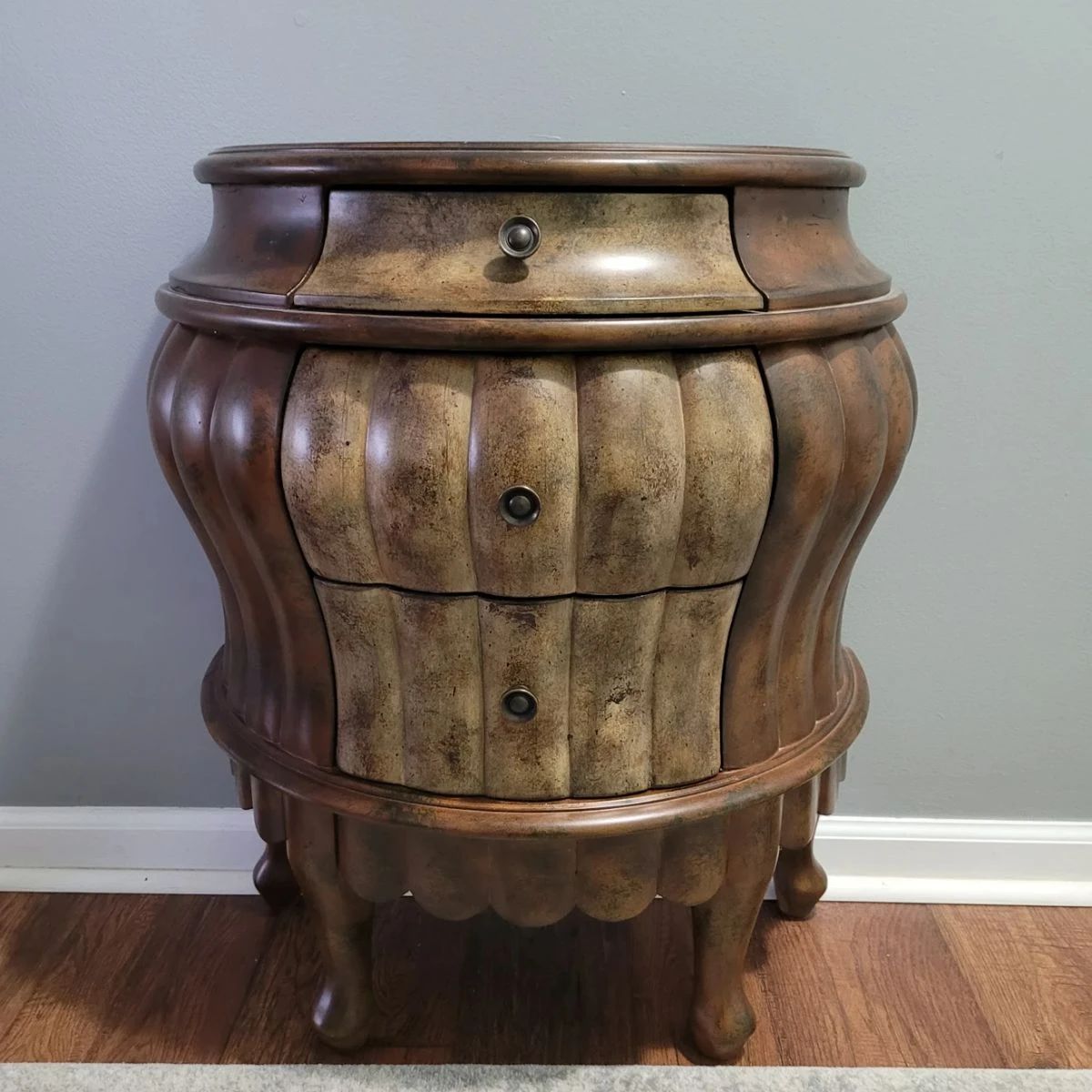 Carved Serpentine Entry table. 3 felt-lined drawers. Excellent condition.