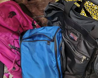 Fine and name-brand travel bags, packs