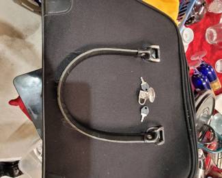 luggage carry on bag. with keys and padlock
