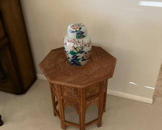Carved table with inlay
