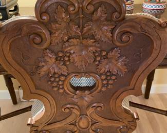 Intricate carving on back of chair