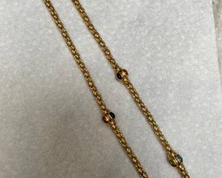 Long gold necklace with semi precious stones