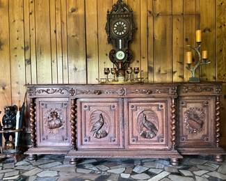 Large sideboard with hunting scene carvings. 101 X 40 X 21"