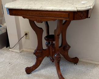 Antique walnut parlor table with marble top