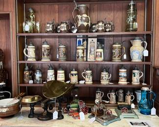 Large collection of German beer, pitchers, and Steins, including Metttlach