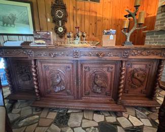 Large sideboard with hunting scene carvings. 101 X 40 X 21"