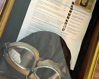 Superb prewar leather flight helmet and goggles identified.