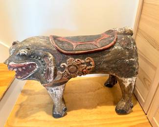 Side view of carved pig sculpture.