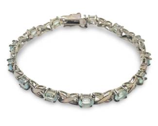 Enticing DBJ Sterling Blue Topaz Tennis Bracelet