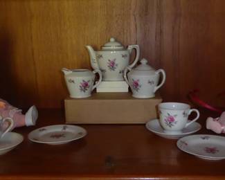 Vintage Grantcrest Children's China Tea Set  
Japan 1950s - excellent condition
White porcelain with hand painted pink rose accents
Set includes: teapot, cream, sugar bowl, cups (5), saucers (6), plates (6)

