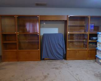 Scandinavian Teak Etagere 
Classic teak wall unit consisting of four units w/accent lights; custom wine glass rack 
173" L; 77.5" H; 21" D